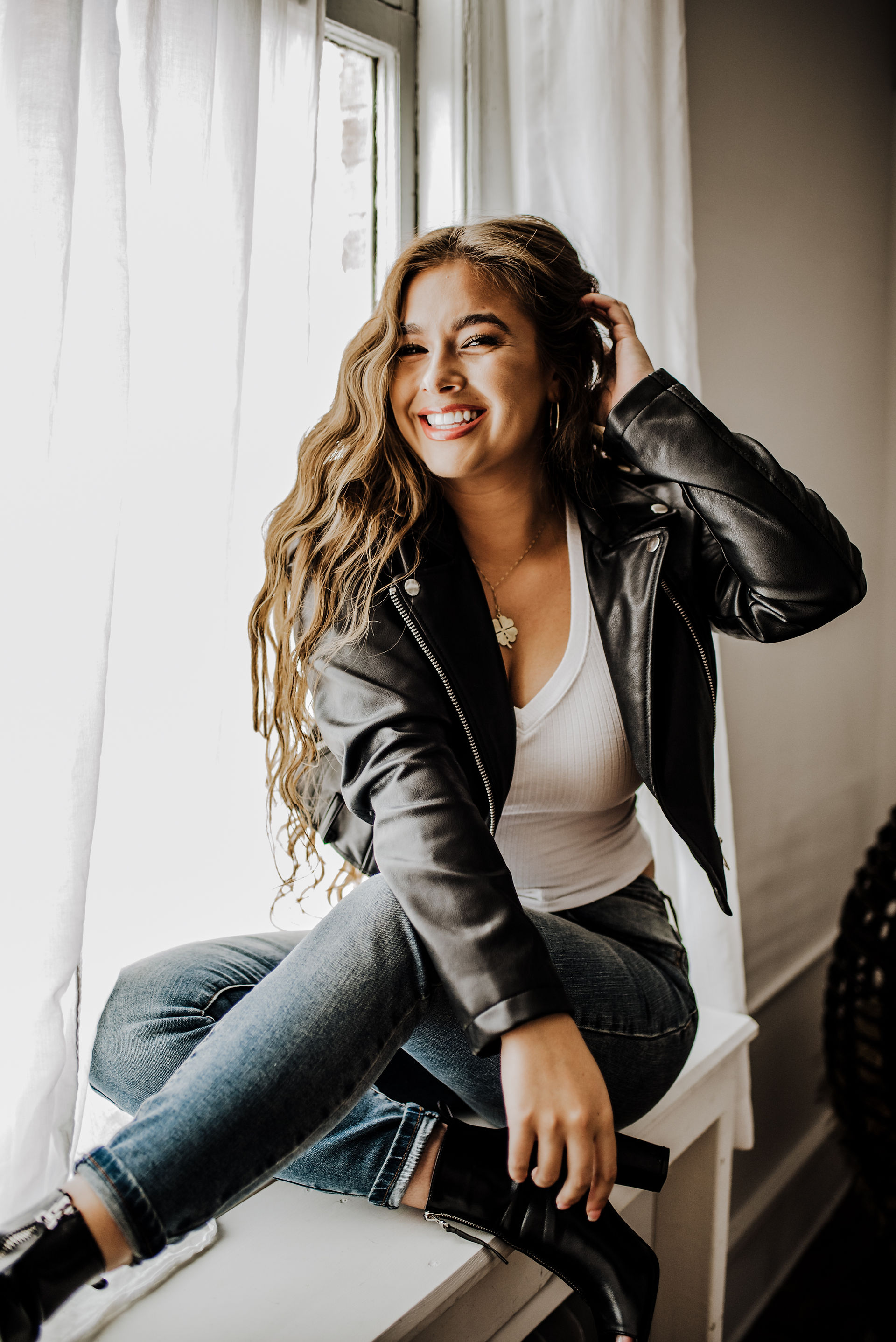 woman wearing black leather jacket