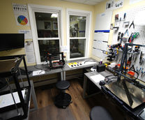 Bauen Innovations customer repair workroom with benches, tools, and 3D printers for service and repair