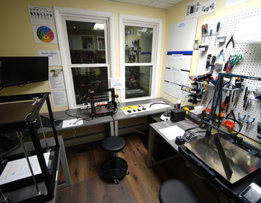 Bauen Innovations customer repair workroom with benches, tools, and 3D printers for service and repair