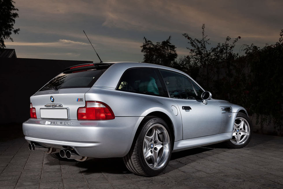a silver bmw Z3 M coupe with the letters m on the back, clown shoe 