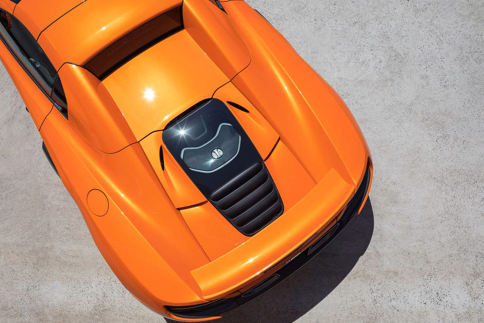 Orange Mc Claren supercar overhead camera angle