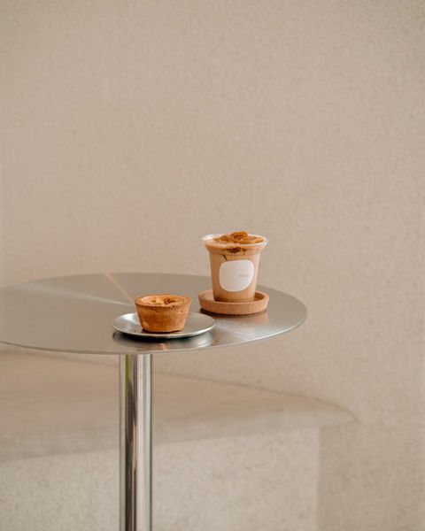 Minimalist Singapore coffee shop setup with espresso cups and contemporary table styling