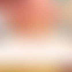 A low-angle, close-up shot focusing on a woman's finger pointing to a choice on a restaurant menu