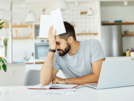 A man facepalm while having a headache