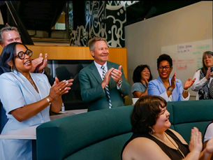 Apple Developer Academy leaders, Michigan State University President, and audience members applauding G2MDA’s presentation, celebrating the company’s growth beyond Apple and the overwhelming support received from the community.