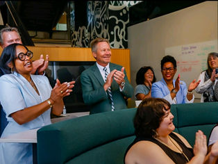 Apple Developer Academy leaders, Michigan State University President, and audience members applauding G2MDA’s presentation, celebrating the company’s growth beyond Apple and the overwhelming support received from the community.