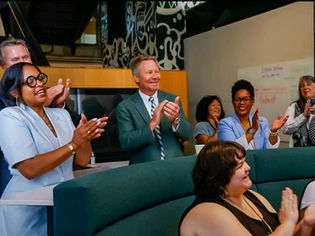 Apple Developer Academy leaders, Michigan State University President, and audience members applauding G2MDA’s presentation, celebrating the company’s growth beyond Apple and the overwhelming support received from the community.