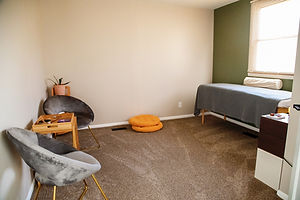 Quiet QHHT session room with soft chairs at Healing Homes & Hearts