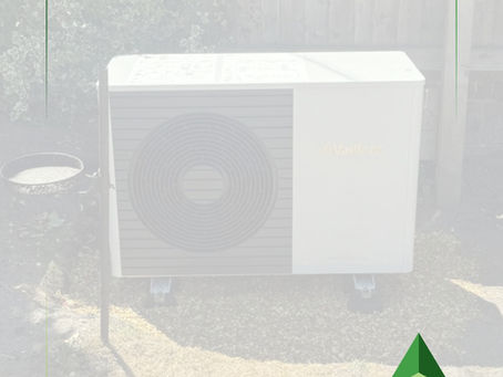 Air source heat pump unit installed externally at a residential property, representing renewable heating system maintenance and optimisation.