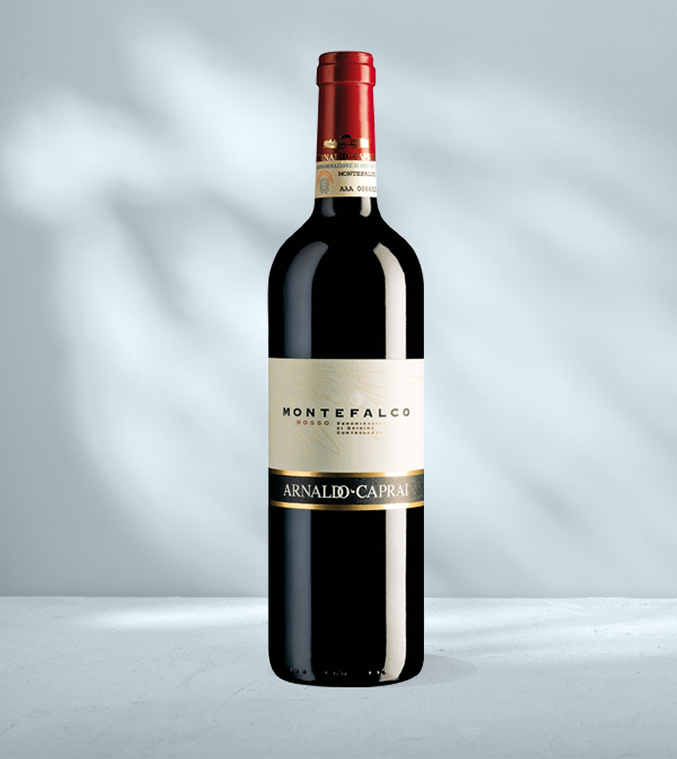 Bottle of Arnaldo Caprai Montefalco Rosso with white and black label with Arnaldo Caprai branding and Montefalco designation
