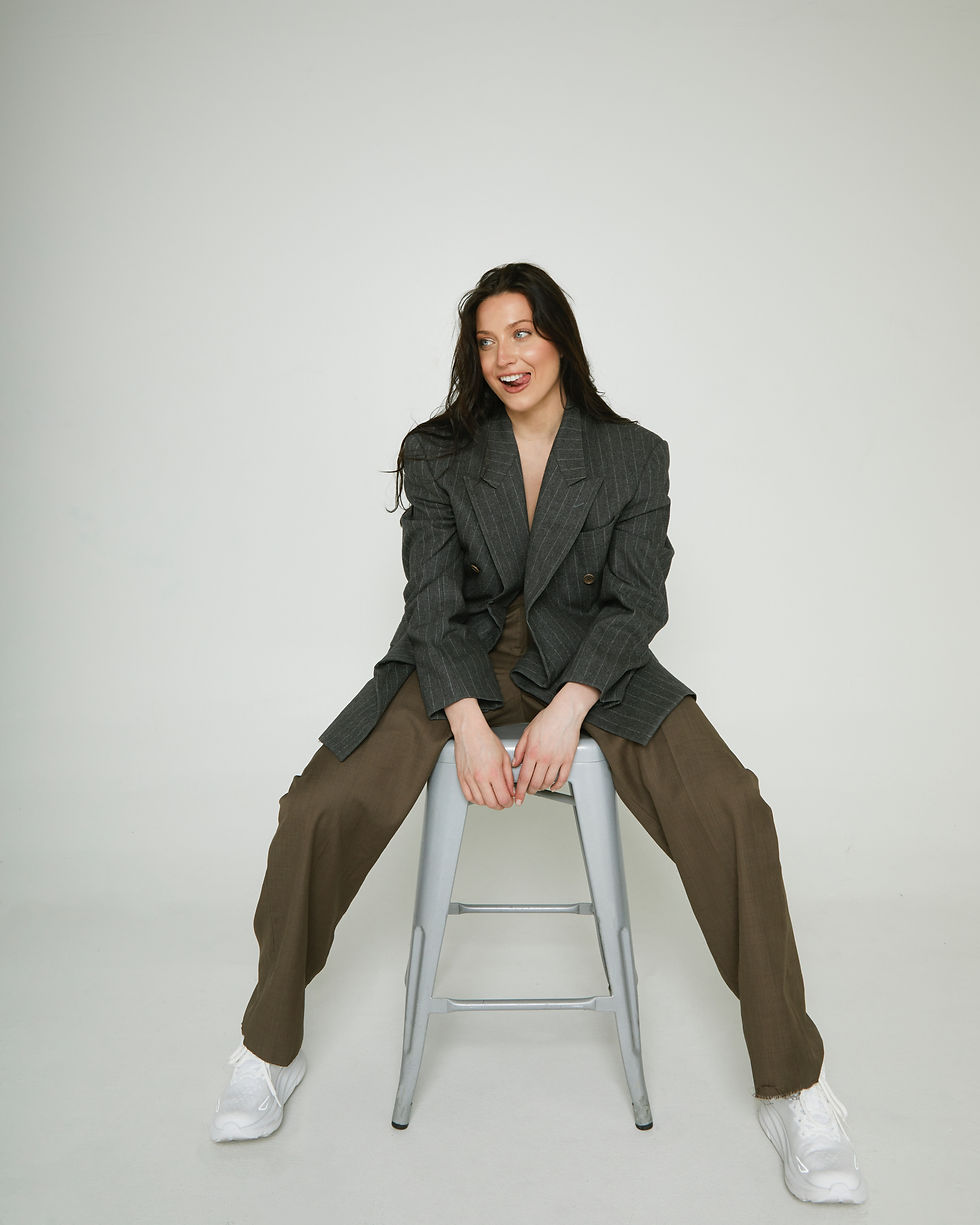 Lon Carter On a chair smiling