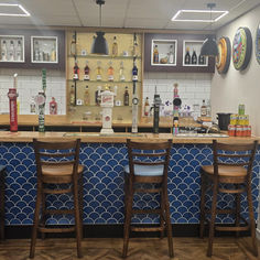 Commercial bar area with beer taps and high chairs