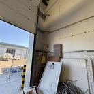Warehouse interior with loading dock and clutter