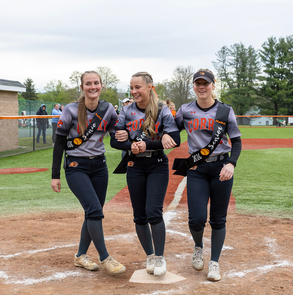 Seniors Rachel Moats, Sydney Mineo, and Mahra Goodwill touch home plate after taking a lap around the diamond on Senior Night. Photo Credit: Lockwood Photography https://www.lockwoodphotography.net/