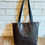 Thumbnail: White mudcloth & black leather tote bag