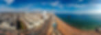 An aerial photo of Brighton showing the sea, the i360, beach and pier