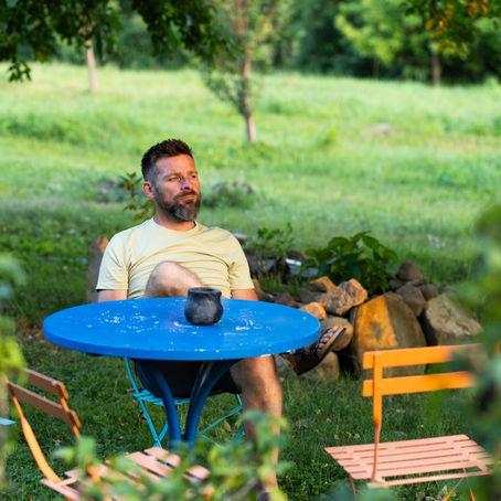 Man sitting quietly in deep thought, reflecting on a mistake while feeling conviction in his heart and seeking guidance and forgiveness from God.
