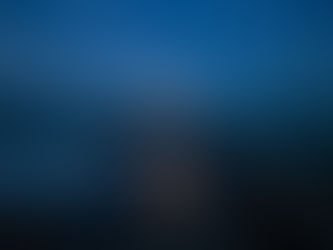 A tall Christian cross stands on a wooden pier surrounded by a stormy, dark ocean, with waves crashing beneath it and dramatic night skies glowing with heavy clouds above.