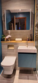 Glasgow Interior Designer bathroom with a sink and toilet and a bottle of hand soap
