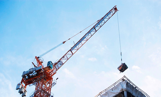 Crane lifting on construction site