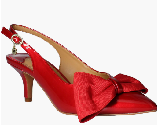 Red slingback high heel with a large bow and ankle strap, isolated on white.