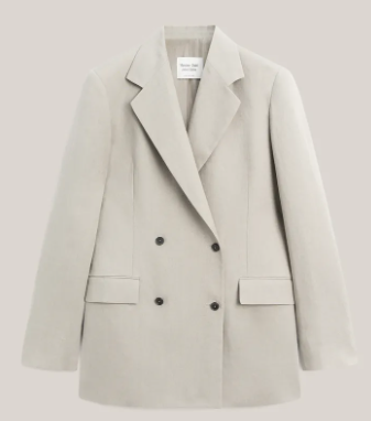Beige double-breasted blazer with black buttons on a plain light background, with a small inner label.