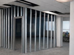 application of interior steel framing in a office building, drywall studs and tracks