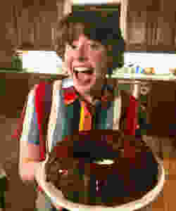 person holding chocolate cake