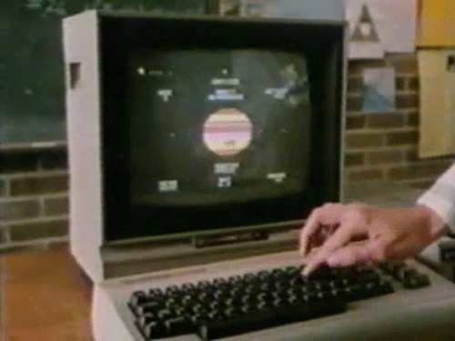 Finger pressing keyboard on old computer