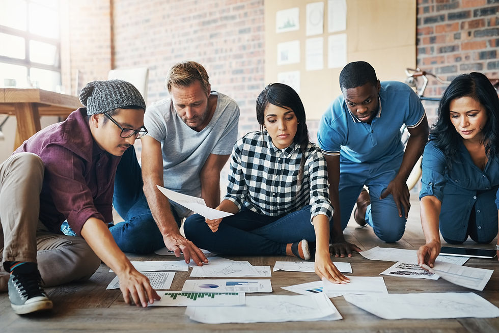 People, creative and work in office with paperwork, collaboration and research for results