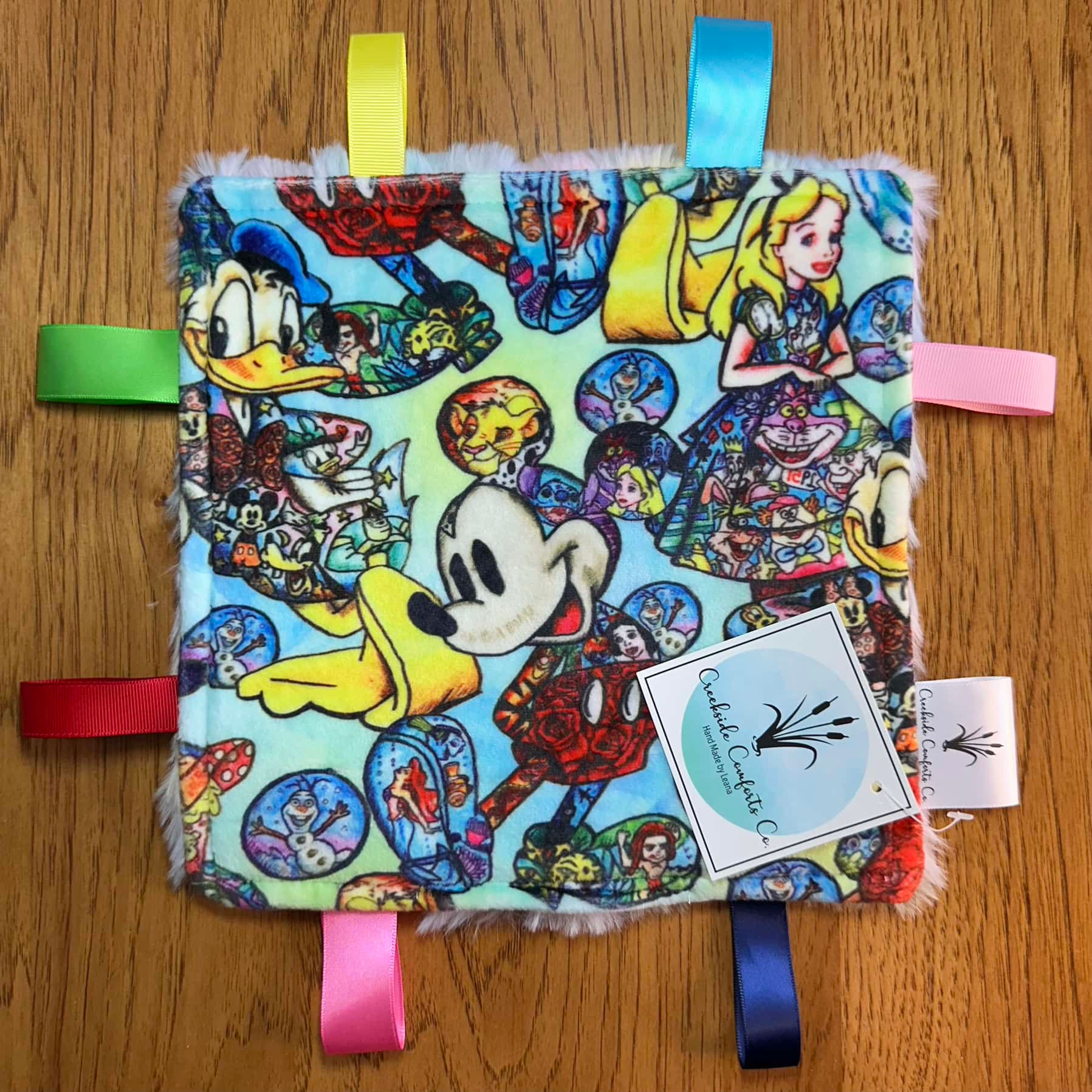 Crinkle Minky Tag Toy - Grafitti Movie Characters (pale blue)