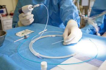 Doctor preparing for vein surgery.jpg