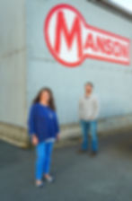 Two people at a marine yard in Seattle. 