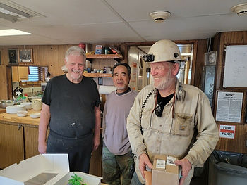 Three men at a retirement celebration.