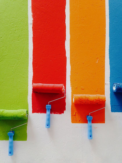 four orange, green, blue, and red paint rollers_edited_edited.jpg