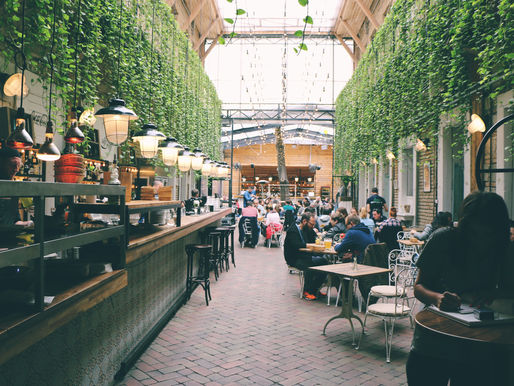 Modern specialty coffee café interior in Sydney with baristas preparing espresso.