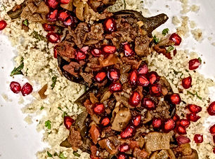Imam biyaldi or Turkish twice cooked eggplant with preserved lemon scented couscous