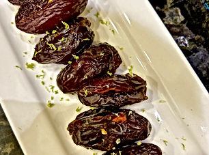 Warm dates with almonds and lime zest