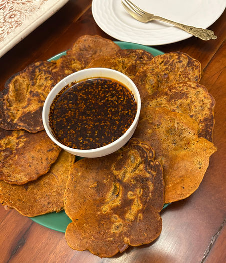 Korean kimchi pancakes with dipping sauce (Kimchi jeon)