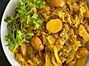 Potatoes and cabbage in ginger turmeric sauce (Atakilt)