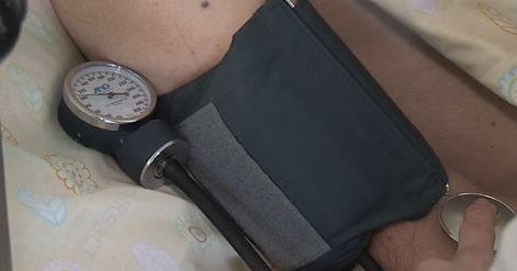 Blood pressure cuff in bed.JPG