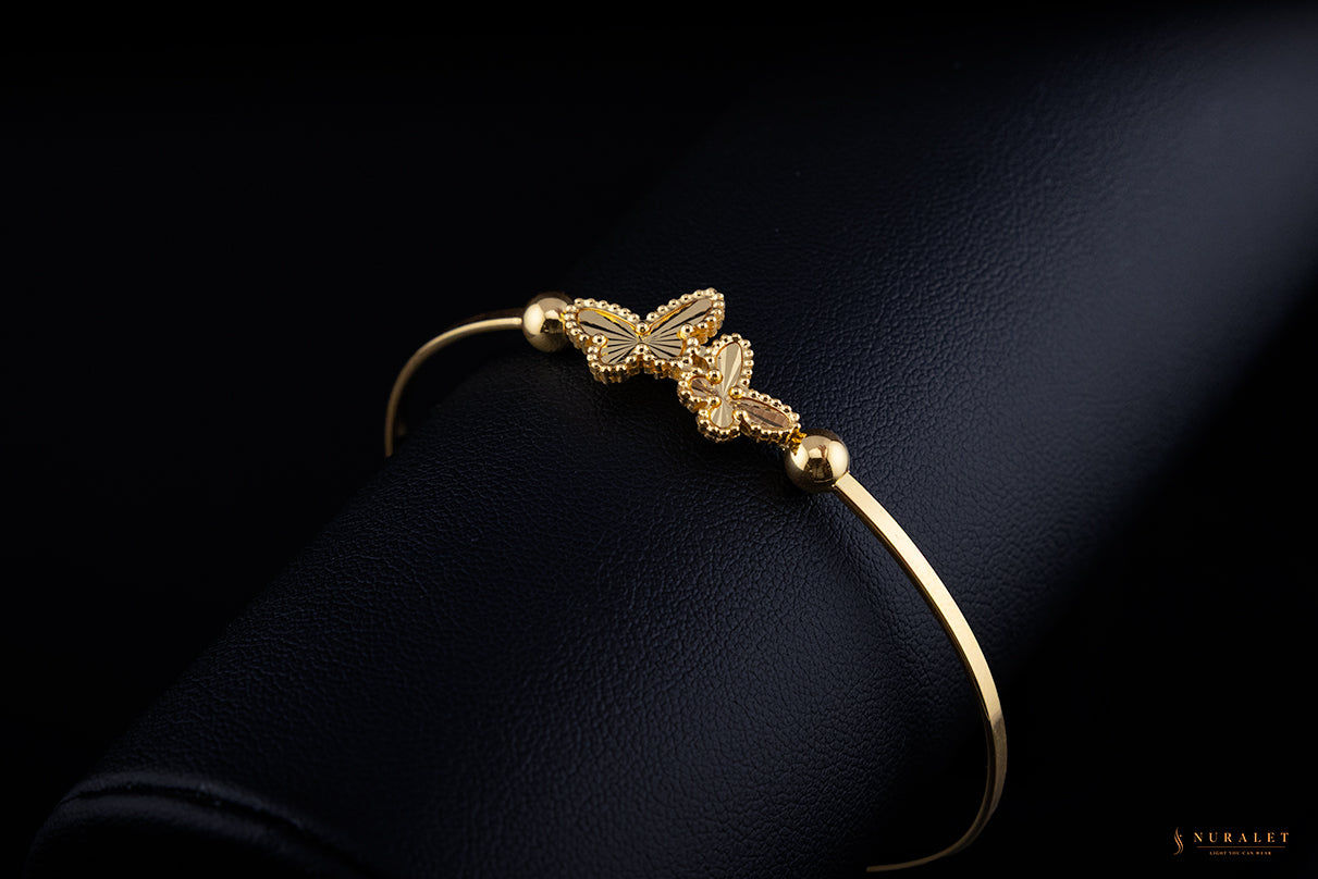 Double butterfly charm bangle in 24k gold