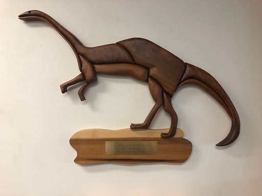 Wooden Anchisaurus logo