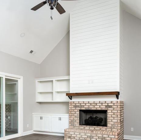 Brick fireplace in Custom built White House with luxurious kitchen and bathroom. Columbia, SC