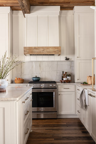 Custom kitchen with hardwood floors and wood ceilings, white cabinets. Custom home in Blackstock SC