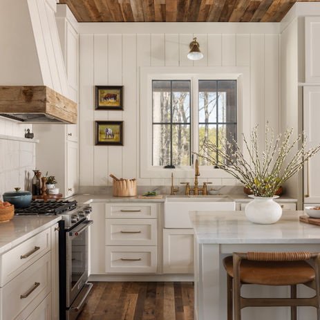 Custom kitchen with hardwood floors and wood ceilings, white cabinets. Custom home in Blackstock SC