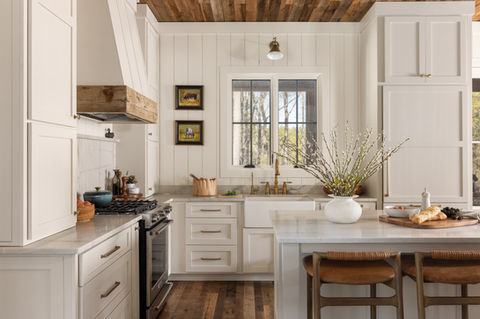 Custom kitchen with hardwood floors and wood ceilings, white cabinets. Custom home in Blackstock SC