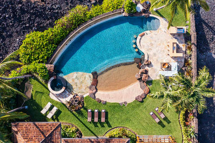 Overhead view of infinity pool at Hualalai vacation rental home with ocean view