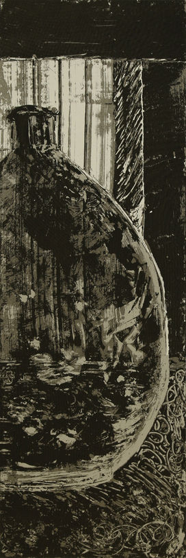 One large, round, silvery grey and black glass bottle on a grey and black scribbled surface against a light grey and black window and wall background