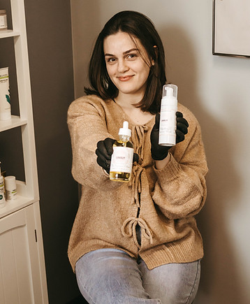 A licensed esthetician and the owner of Beauty Scaped by Kayla.
